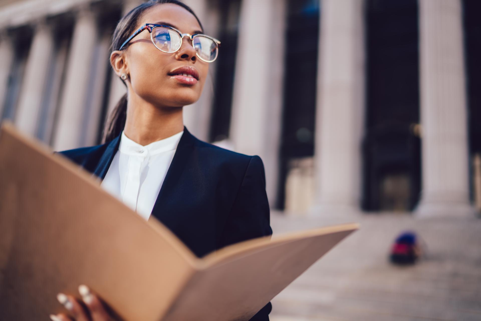 Professional woman holding file with her