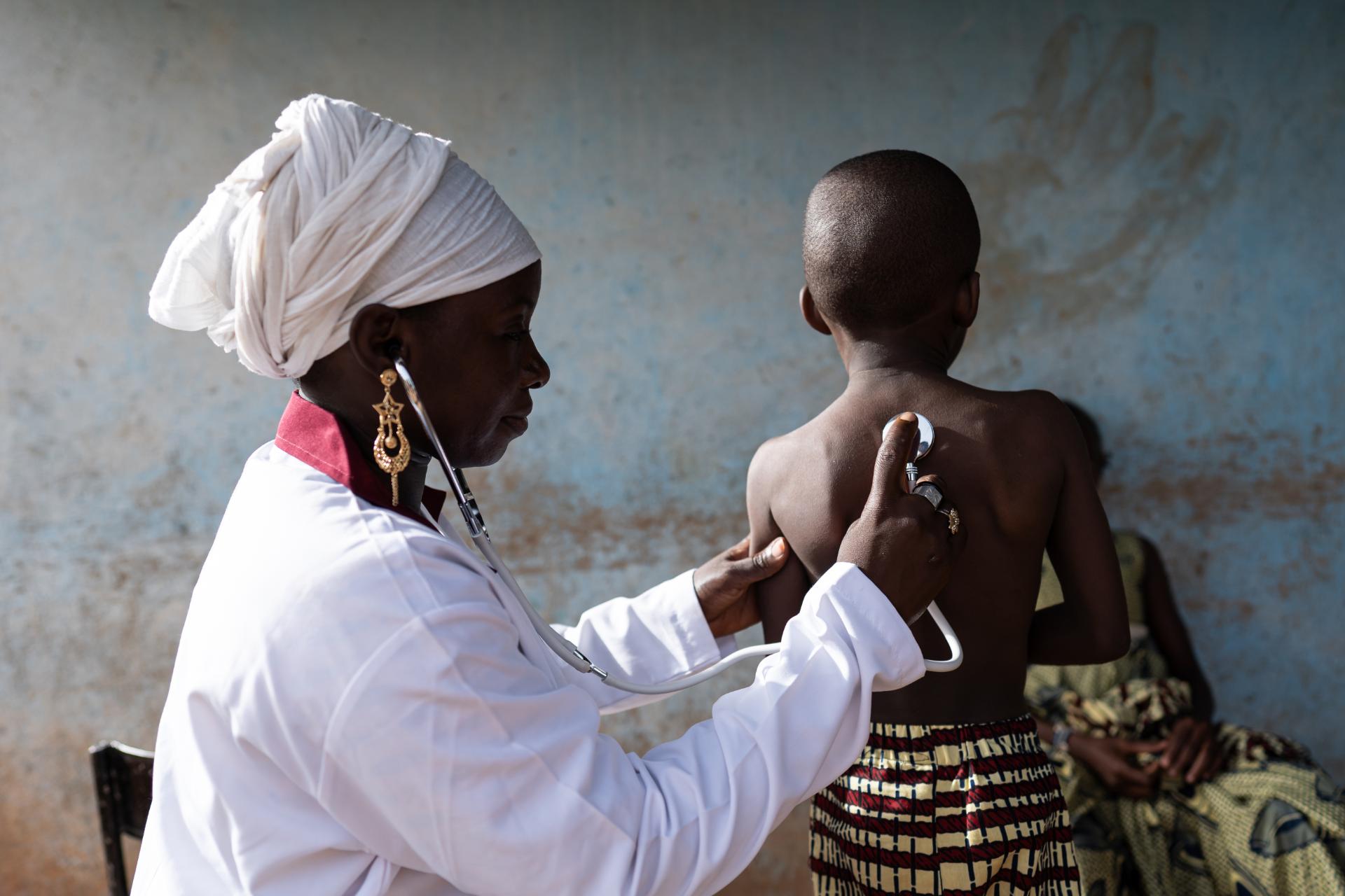 Doctor testing child